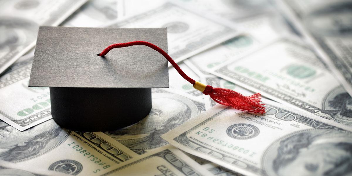 graduation cap on top of $100 bills